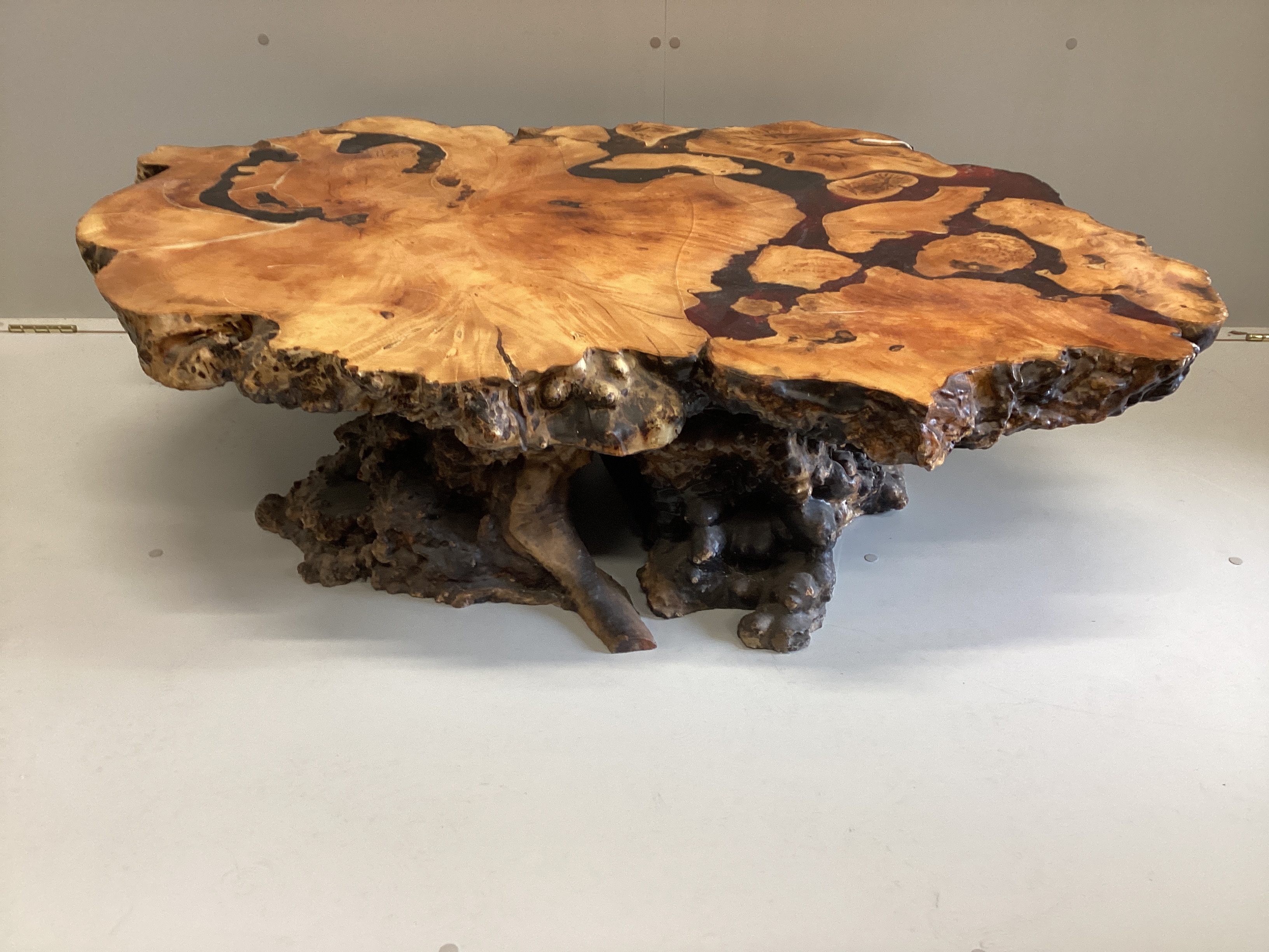 An American redwood and coloured resin trunk section coffee table circa 1970, width 130cm, depth 90cm, height 37cm